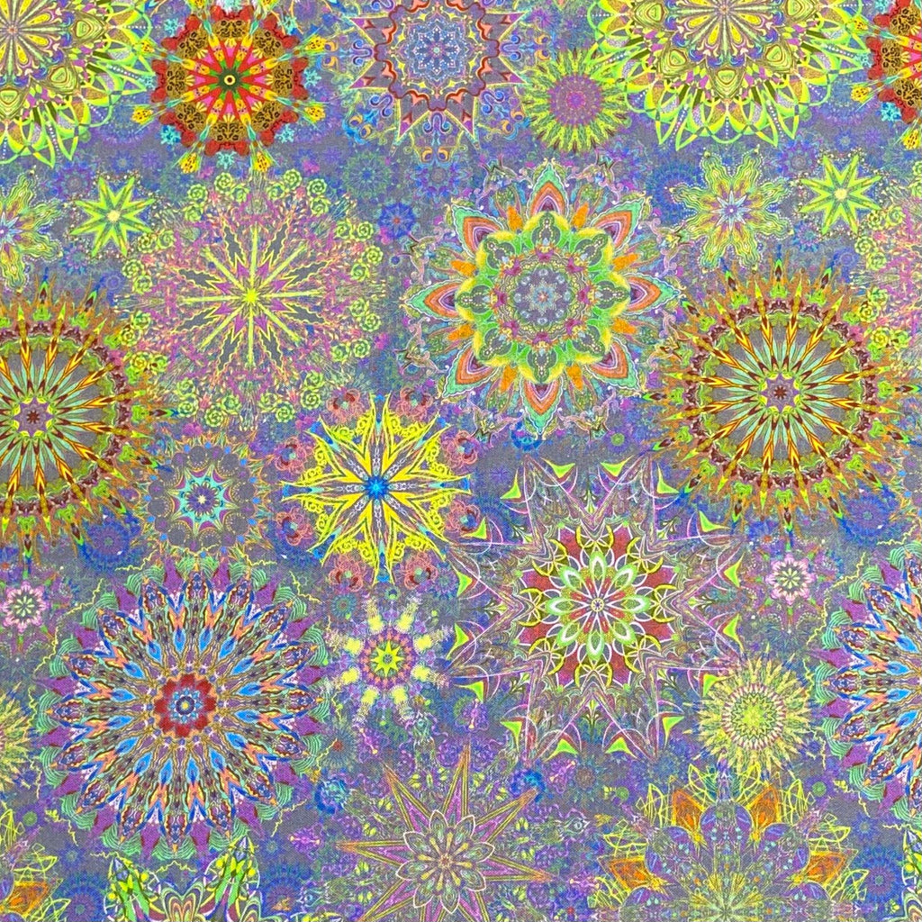 A seamless repeating pattern of vibrant, intricate mandala and kaleidoscope designs in neon yellow, green, pink, orange, and blue over a textured purple and blue background.